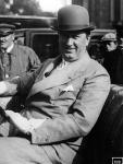 109. Ettore Bugatti sitting in drivers seat of car