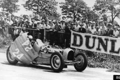 86. Type 59 ACF 23 June 1935 (Montlhery). Car 24, Robert Benoist. Grapples with and catches his cars errant bonnet. (retired later in race).