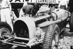 89. Type 59 ACF 23 June 1935 (Montlhery). Car 24, Robert Benoist. Mechanic Lucien Wurmser at work. (retired).