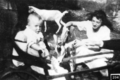 204.Lidia Bugatti with a not very happy baby Roland Bugatti and the goats
