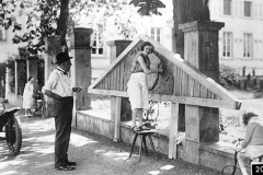 206. Lidia Bugatti standing on a stool and Paul Troubetskoy looking on with his Lancia Lambda just in the picture c1928