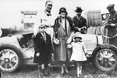 126A Malcolm Campbell and wife with Donald and Jean. Hugh McConnel, scrutineer, wiring up bonnet. JCC 200 mile race, Brooklands, 15 October 1927